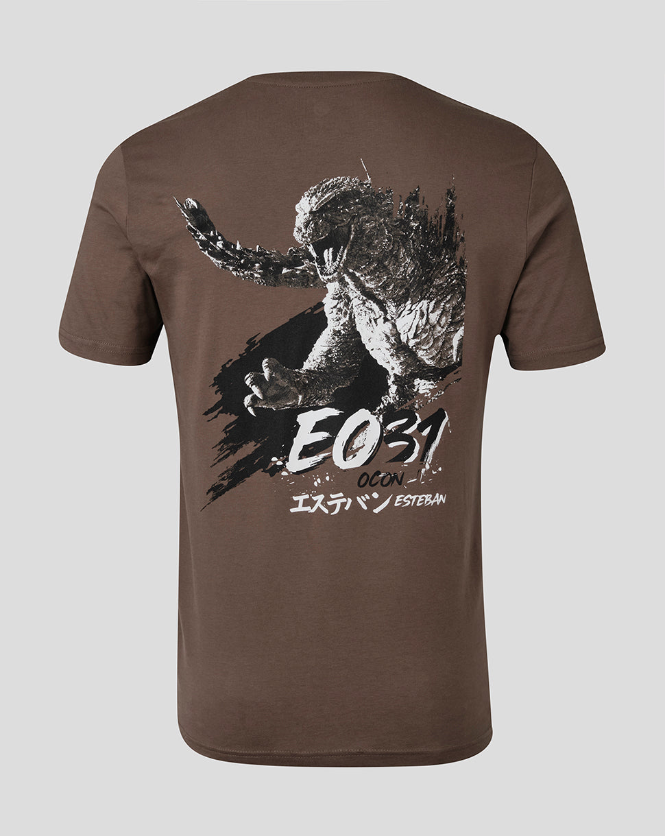 A brown short-sleeve t-shirt shown from the back, featuring a large graphic print of Godzilla with the text 'EO31' and Japanese katakana text on a light gray background.
