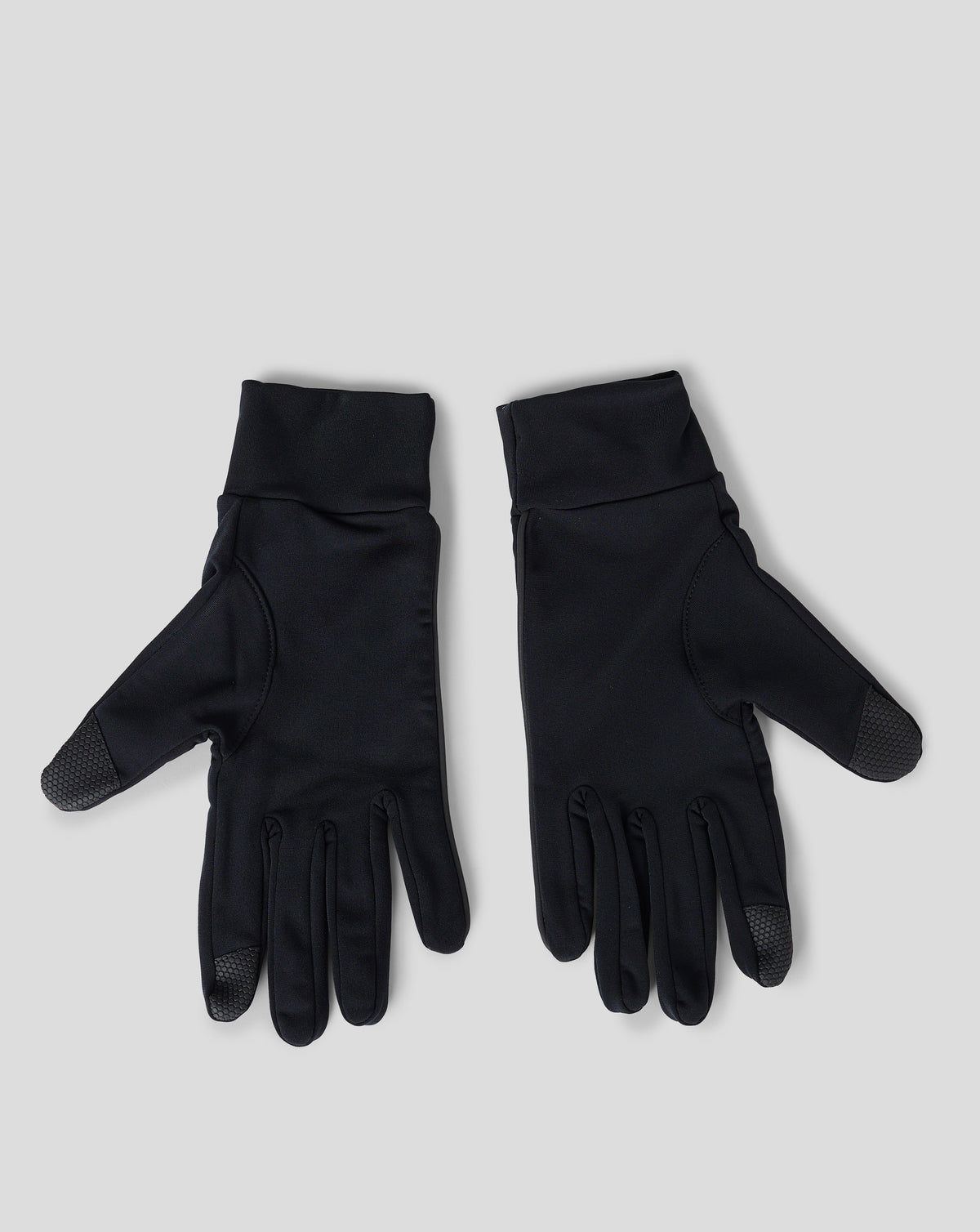 Close-up of black unisex gloves with a white wing logo on the cuff