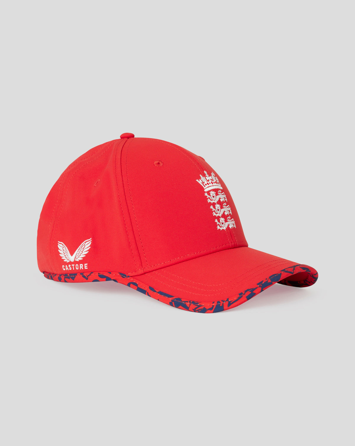 Side view of red England T20 cap with embroidered crest on the front and Castore branding on the back