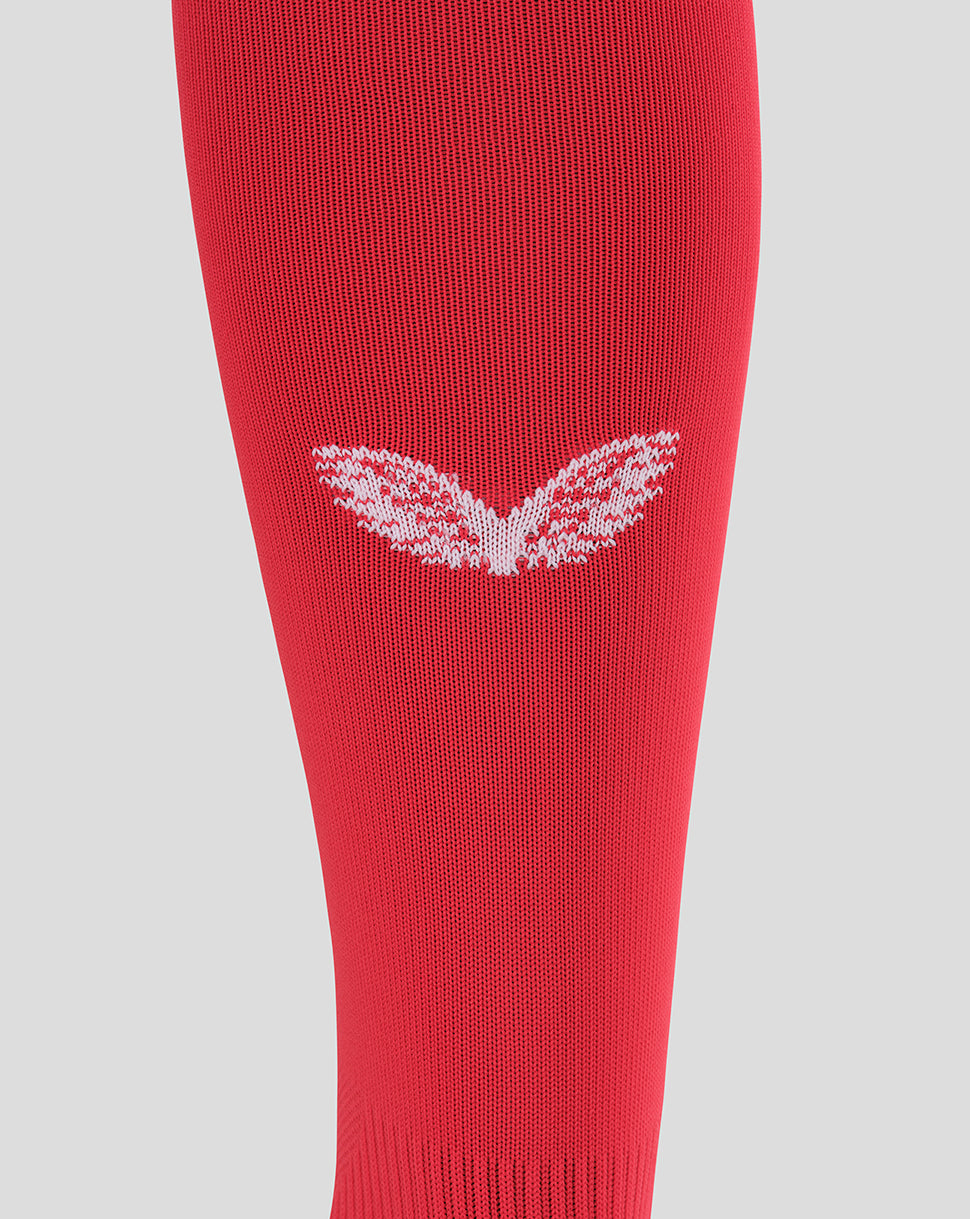 Red Sevilla away sock close up showing a white wing emblem on knit fabric