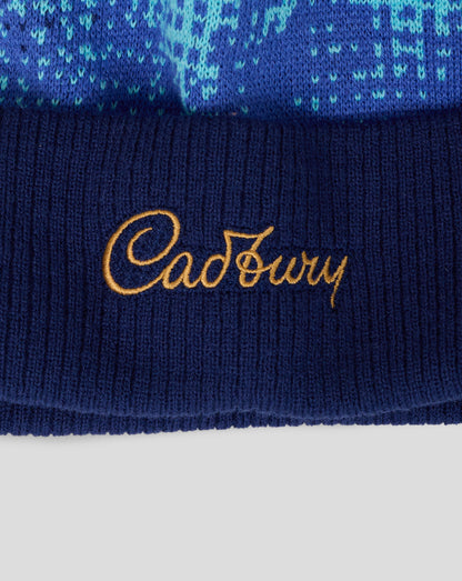 Navy blue fabric with gold 'Cadbury' logo on a white background