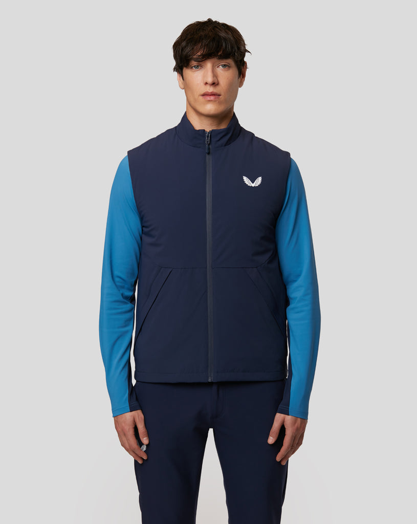 Man in Peacoat navy Stretch Gilet with white Castore logo
