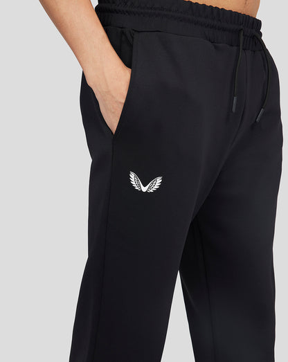 Onyx Flex Jogger in black with white wing logo at the hip and a hand in the pocket