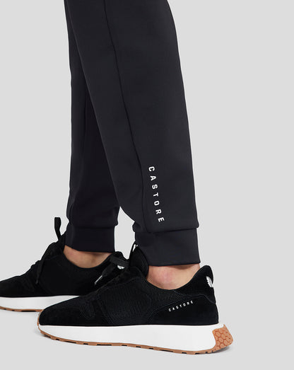 Onyx Flex Jogger leg close-up showing CASTORE branding along the lower leg and black sneakers